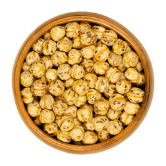 Roasted yellow chickpeas in wooden bowl. Crispy snack, vegan, high protein source, made of cooked...