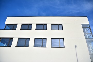 The windows of a modern building for offices. Business buildings architecture.