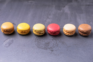 Different types of colourful macaroons in close up, Sweet and colourful french macaroons.