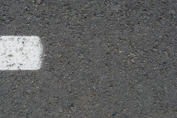 Fototapeta premium New asphalt texture with white dashed line