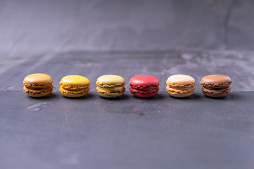 Different types of colourful macaroons in close up, Sweet and colourful french macaroons.