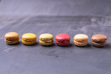 Different types of colourful macaroons in close up, Sweet and colourful french macaroons.