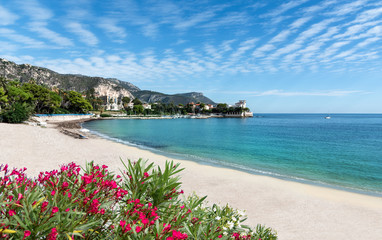 Clean sea water near Saint-Jean-Cap-Ferrat beach and clean sand, on the Azur French coast of Nice
