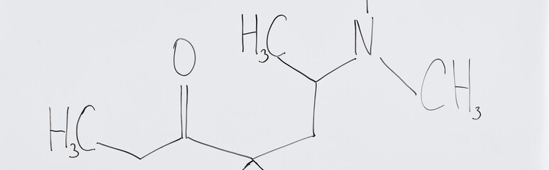 panoramic shot of white board with chemical formula in laboratory