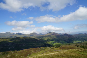 Fototapeta na wymiar High Mountain Range with Brilliant Blue Sky and Clouds - Wales UK