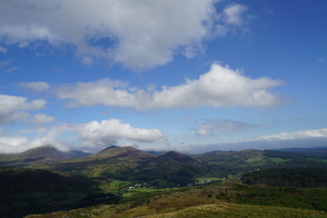 Obraz na płótnie Canvas High Mountain Range with Brilliant Blue Sky and Clouds - Wales UK