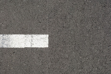 Fototapeta premium New asphalt texture with white dashed line