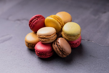 Different types of colourful macaroons in close up, Sweet and colourful french macaroons.