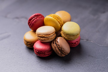 Different types of colourful macaroons in close up, Sweet and colourful french macaroons.