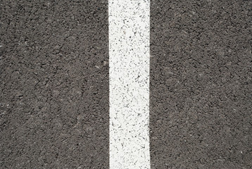 New asphalt texture with white line. Top view