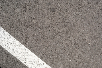 Fototapeta premium New asphalt texture with white line. Top view