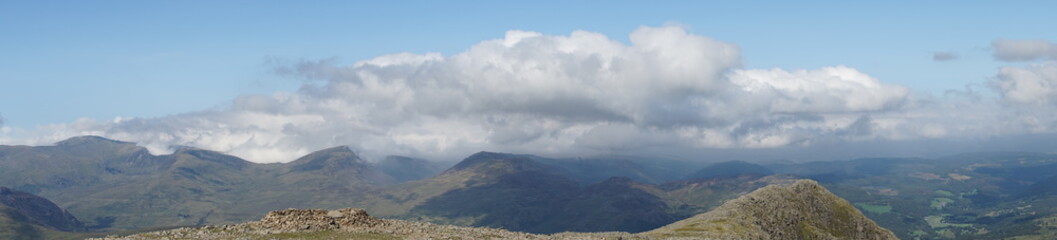 Fototapeta premium Mountain Range Covered in Clouds
