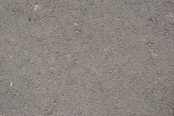 Smooth asphalt road. Tarmac dark grey grainy road background. Top view grunge rough surface