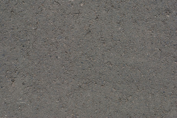 Smooth asphalt road. Tarmac dark grey grainy road background. Top view grunge rough surface