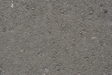 Smooth asphalt road. Tarmac dark grey grainy road background. Top view grunge rough surface