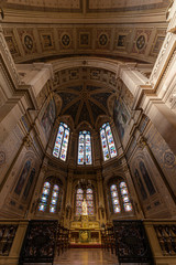 Fototapeta na wymiar Inner view of the Saint Trinity church in Paris, illuminated by the early autumn light through the tainted glasses