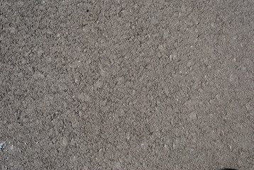Smooth asphalt road. Tarmac dark grey grainy road background. Top view grunge rough surface