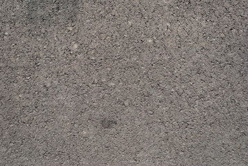 Smooth asphalt road. Tarmac dark grey grainy road background. Top view grunge rough surface
