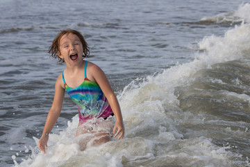 Young girl having fun in the ocean