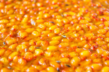 Fresh sea buckthorn jam. Close-up. Background. Texture.