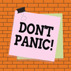 Text sign showing Don T Panic. Business photo text suddenly feel so worried or frightened that you can not behave Paper stuck binder clip colorful background reminder memo office supply