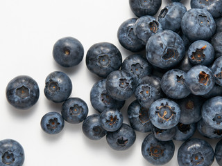 Blue berry isolated on white background. Food ingredients. Fresh fruit.  Ripe and juicy fresh picked bilberries close up.