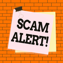 Obraz premium Text sign showing Scam Alert. Business photo text fraudulently obtain money from victim by persuading him Paper stuck binder clip colorful background reminder memo office supply