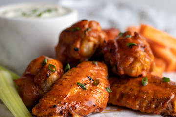 Buffalo chiken wings with bbq sauce and celery