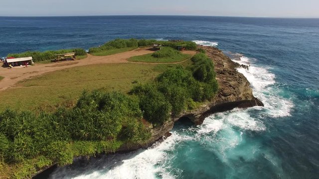Tidal erosion of the rocky cliffs present a serious hazard to unknowing hikers, most of whom are foreign tourists to this small Indonesian island