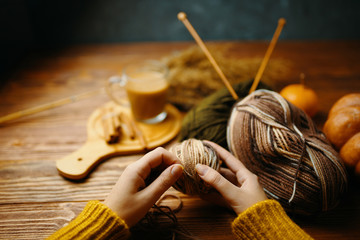 Pumpkin and coffee, knitting. Flay lay autumn pumpkins with knitting sweater and coffee.