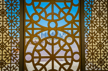 Doha's modern business district viewed through an Islamic design screen © Brian Scantlebury