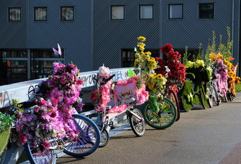 Bicycle decorated with flowers on a dutch bridge in amsterdam, the netherlands