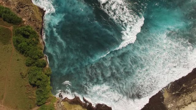 Nearly a full minute of stationary overhead view of rough surf in Bali