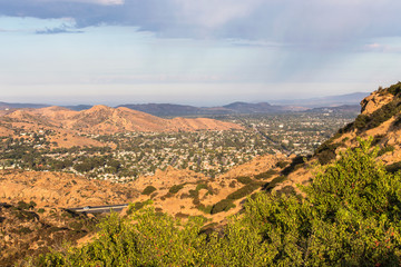 Morning mountaintop view of hilltops and suburban homes in Simi Valley, California.