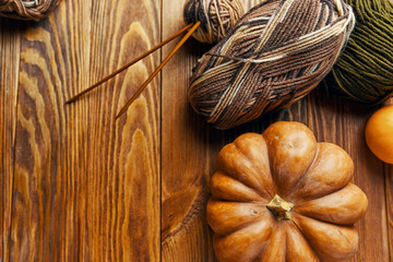 Flay lay autumn pumpkins with knitting sweater