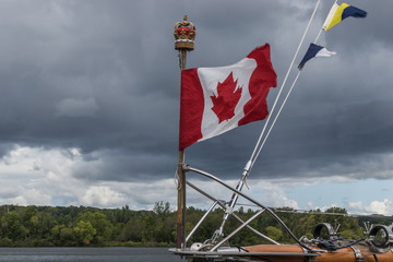 Canadian flag on the bowsprit of a tall ship on the Great Lakes