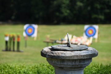 Sundial with Archery Targets in Background