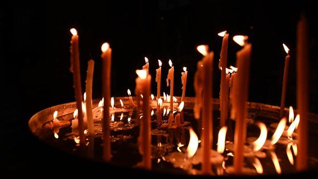 Video of some candles with the flames moved by the wind in the Church of the Holy Sepulchre.. The Church of the Holy Sepulchre is a church in the Christian Quarter of the Old City of Jerusalem, Israel