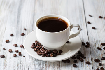 White coffee Cup on light wooden background