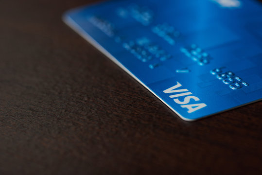 Blue Visa Card On Wooden Background