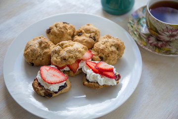 Scones with cream, strawberry and Jam