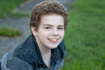 Face and chest of curly haired young boy