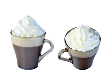 Cappuccino in a glass mug with whipped cream. The photo.