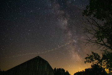 Fototapeta na wymiar Milky Way galaxy over the old barn