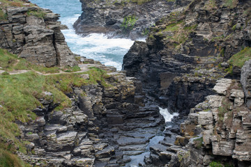 River running into the sea through rocks