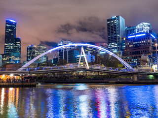 Modern city bridge over the Yarra river in Melbourne, Australia at night.