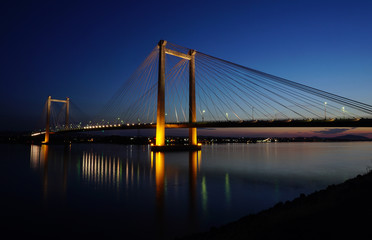 Fototapeta na wymiar Bridge over Columbia river at night with reflections
