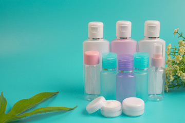Women's cosmetic products placed on a blue background.