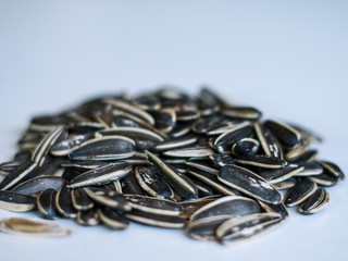 Sunflower seed snack or kuaci on white background.