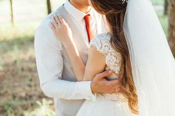 Young wedding couple outdoor. Groom and bride together